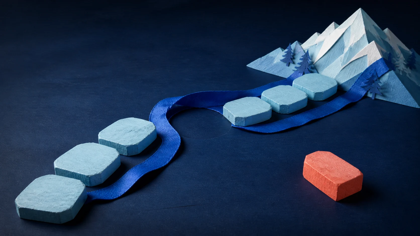 Six pale-blue platforms and an empty seventh position lead toward a mountain; a blue ribbon continues around the gap while a heavy orange block stays off the route, showing that a missed session need not be piled onto the next one.